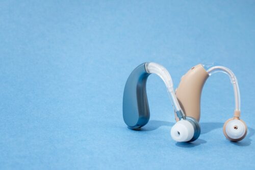hearing-aids-with-blue-background-still-life_23-2149706006 hearing-aids-with-blue-background-still-life_23-2149706006